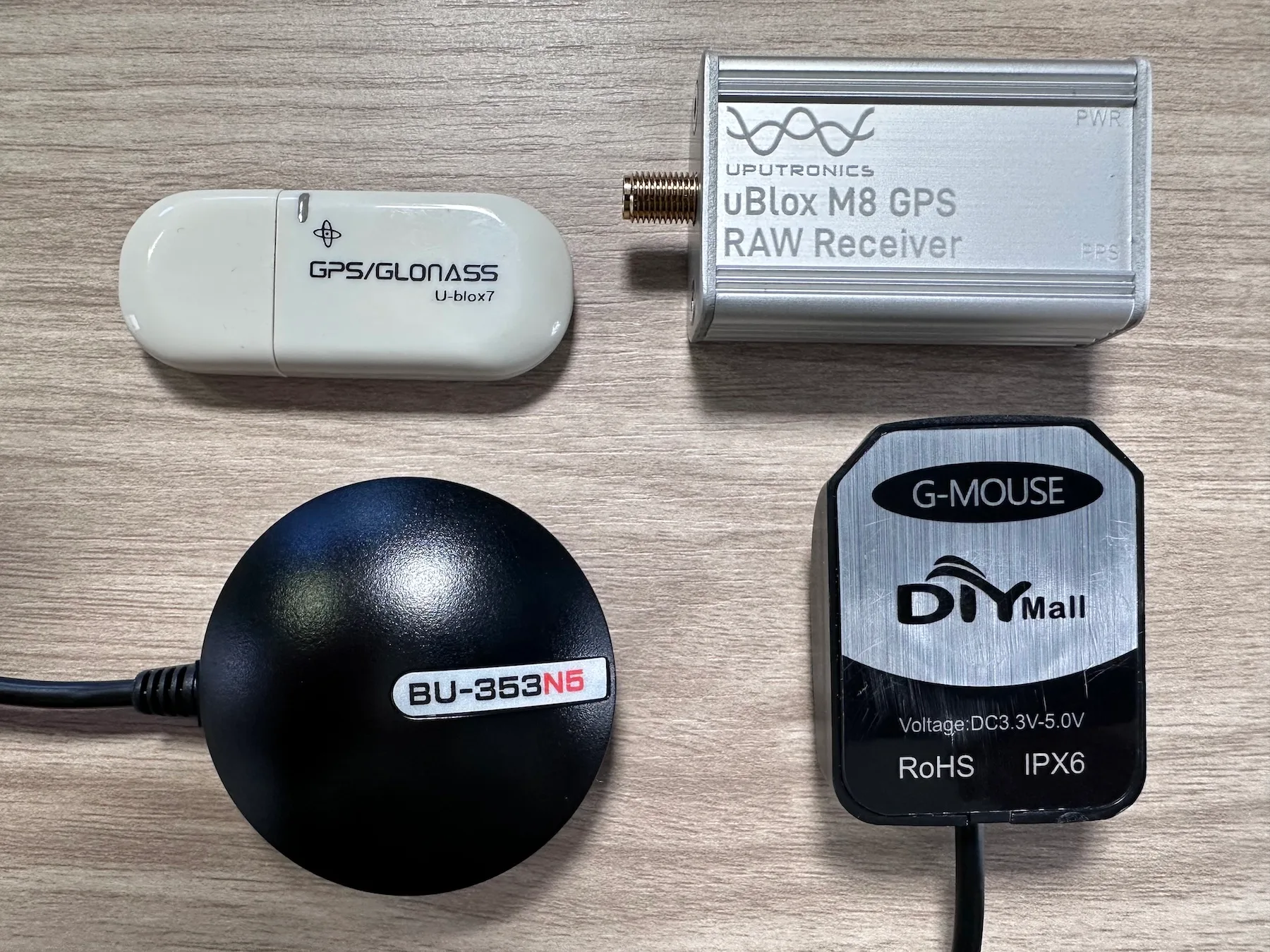 The four USB GPS receivers we tested: VK172, Uputronics uBlox M8, BU-353N5, and VK-162